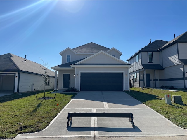 view of front of home with a garage and a front lawn