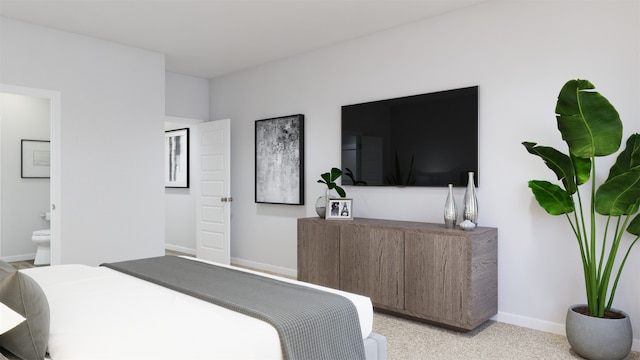 carpeted bedroom featuring ensuite bathroom