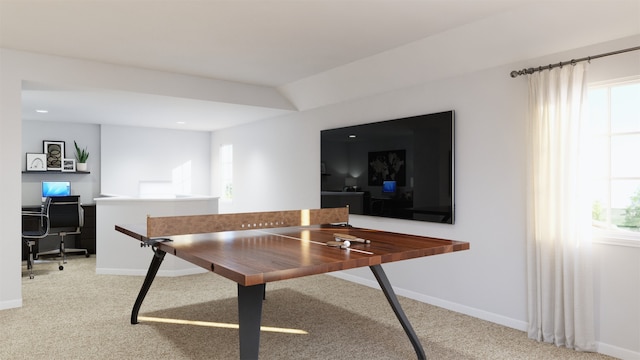 carpeted home office featuring lofted ceiling