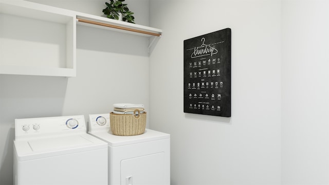 washroom with washing machine and clothes dryer