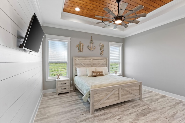 bedroom with a raised ceiling, ceiling fan, ornamental molding, and wood ceiling