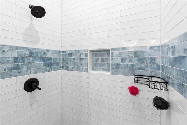 bathroom featuring tiled shower