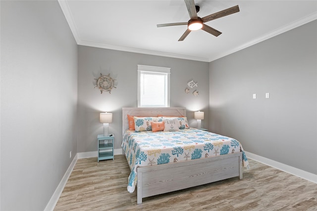 bedroom featuring ceiling fan, ornamental molding, and hardwood / wood-style flooring