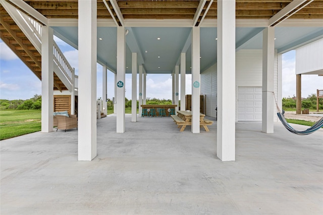 view of patio / terrace featuring a garage