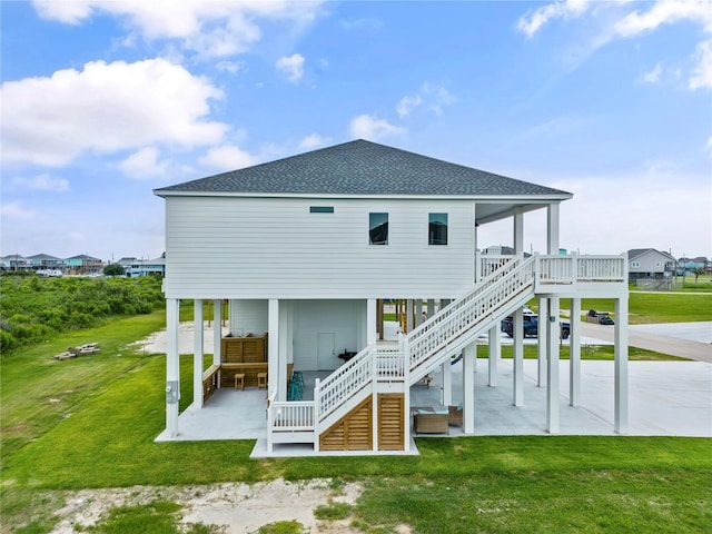 back of property with outdoor lounge area, a patio, and a lawn