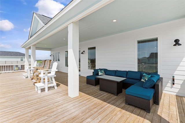 wooden deck featuring outdoor lounge area