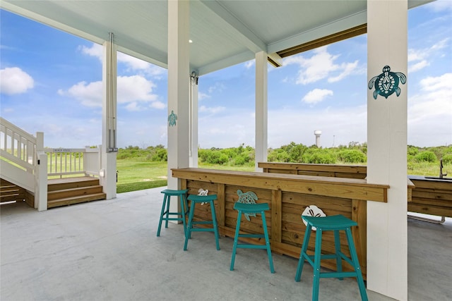 view of patio / terrace with an outdoor bar