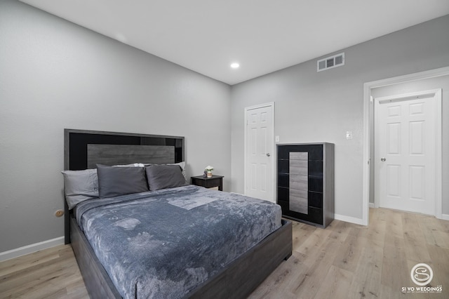 bedroom with light wood-type flooring