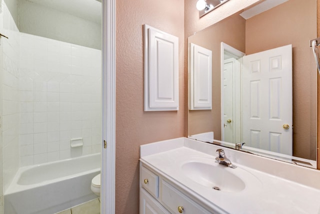 full bathroom featuring tile patterned floors, toilet, vanity, and shower / tub combination