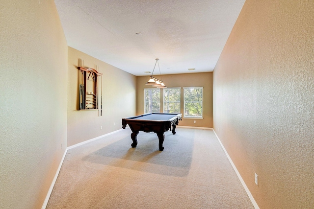 playroom with carpet floors, a textured ceiling, and billiards