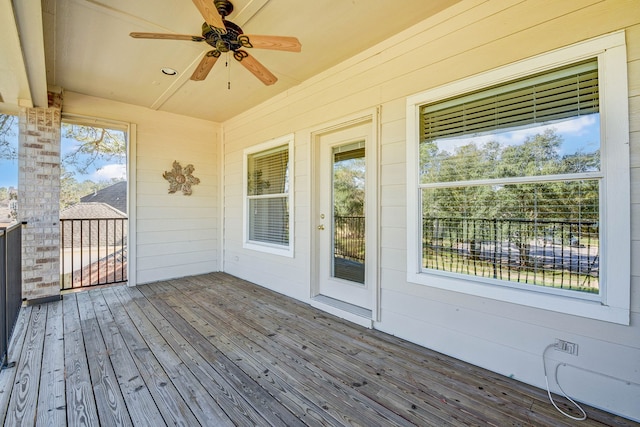 wooden deck featuring ceiling fan