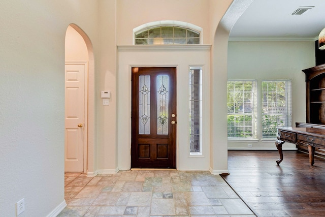 entrance foyer featuring crown molding