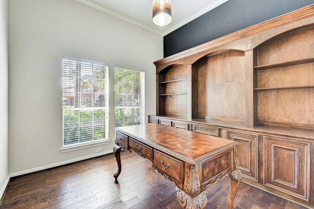 office with dark wood-type flooring, ornamental molding, and built in desk