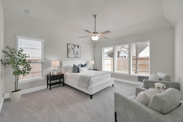 bedroom featuring light carpet and ceiling fan