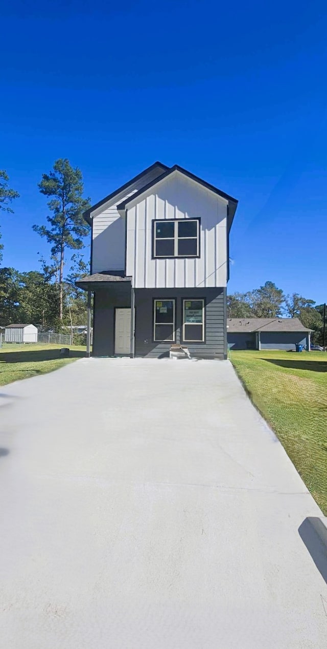 view of side of property featuring a yard