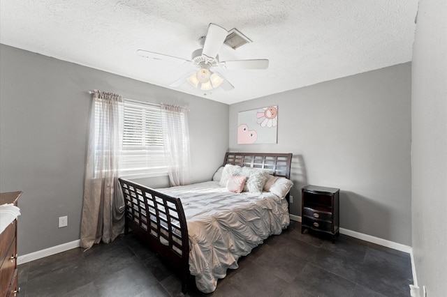 bedroom featuring a textured ceiling and ceiling fan