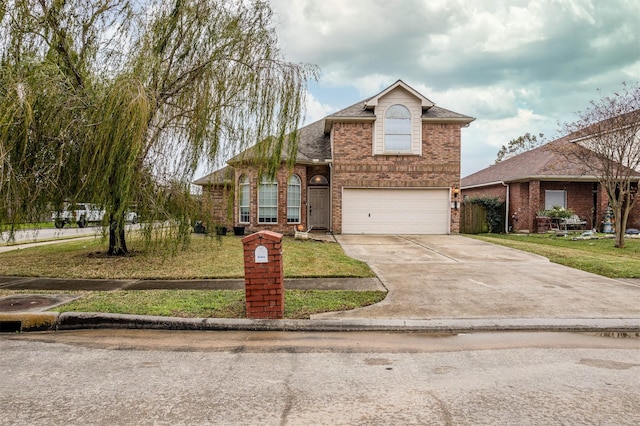 view of front of home featuring a front yard and a garage