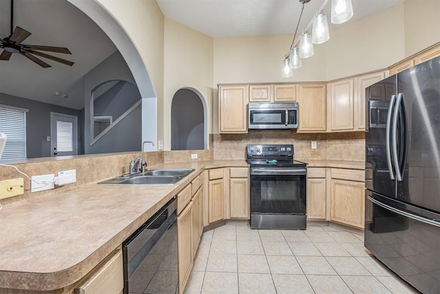 kitchen featuring sink, fridge, range with electric cooktop, black dishwasher, and pendant lighting