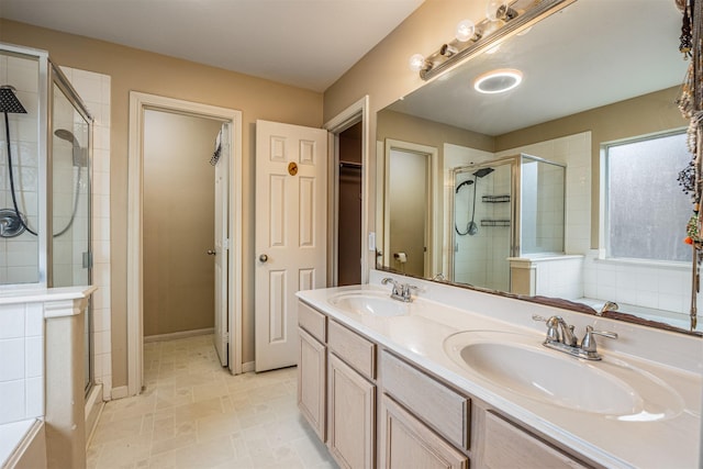 bathroom with walk in shower and vanity