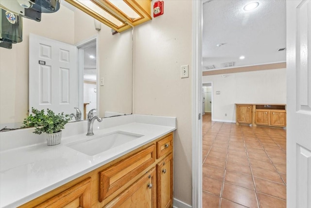 bathroom with tile patterned flooring and vanity