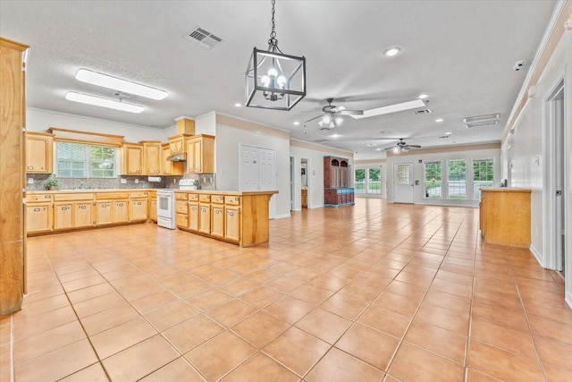 kitchen with white range with electric stovetop, tasteful backsplash, light brown cabinets, and light tile patterned flooring