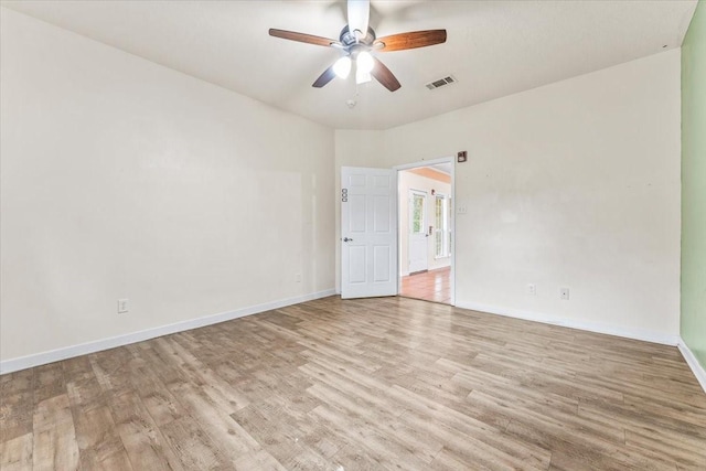 unfurnished room featuring ceiling fan and light wood-type flooring