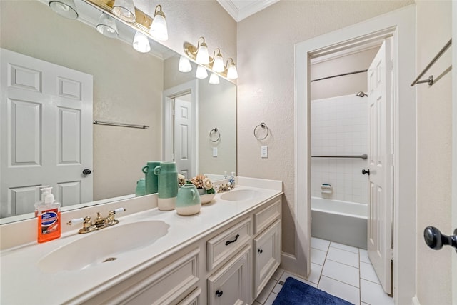 bathroom featuring crown molding, tile patterned flooring, vanity, and tiled shower / bath combo