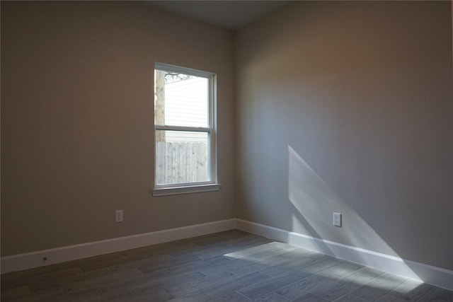 unfurnished room with hardwood / wood-style flooring