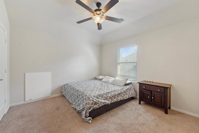 bedroom with ceiling fan and light carpet