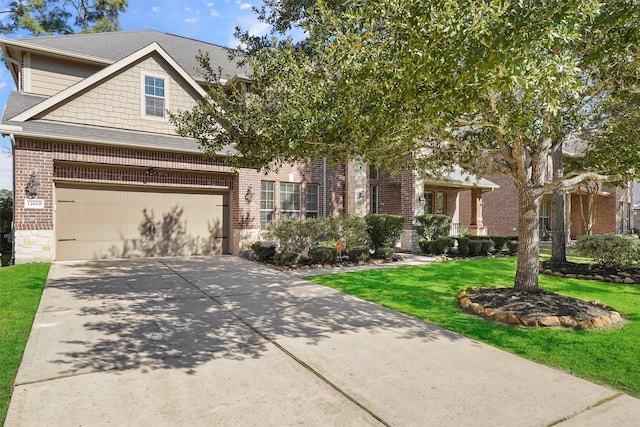 view of front of home with a garage and a front lawn