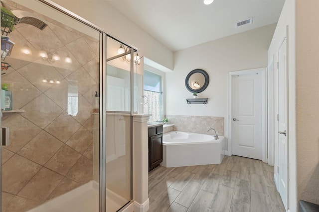 bathroom with shower with separate bathtub