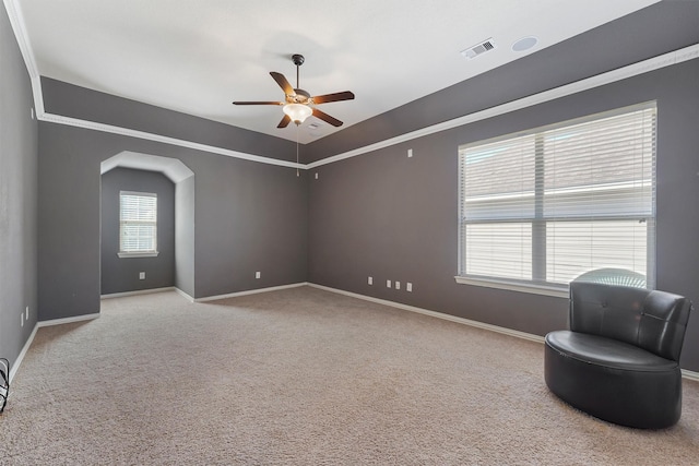 living area featuring ceiling fan and light colored carpet