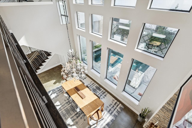 interior space featuring a high ceiling and a notable chandelier