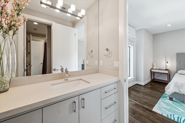 bathroom featuring vanity and hardwood / wood-style floors