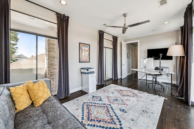 bedroom with ceiling fan and dark hardwood / wood-style flooring