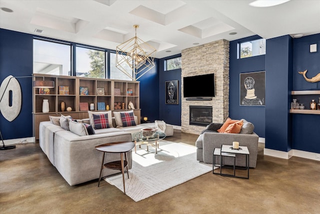 living room with a fireplace, an inviting chandelier, beamed ceiling, coffered ceiling, and concrete floors