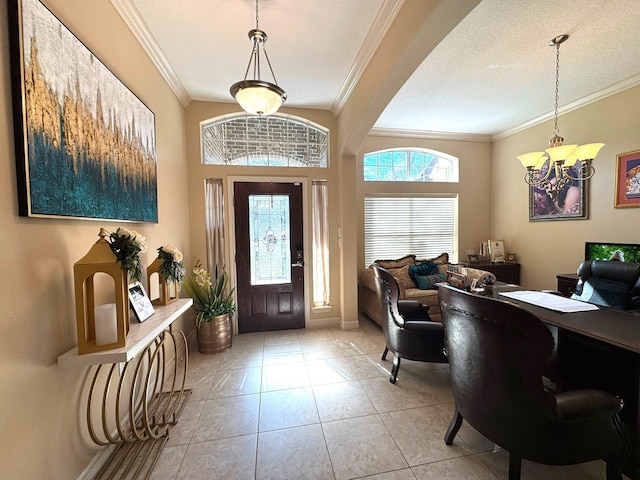 foyer with crown molding, light tile patterned floors, a chandelier, and a textured ceiling