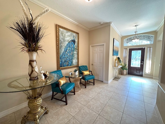 foyer featuring light tile patterned flooring, a textured ceiling, and ornamental molding