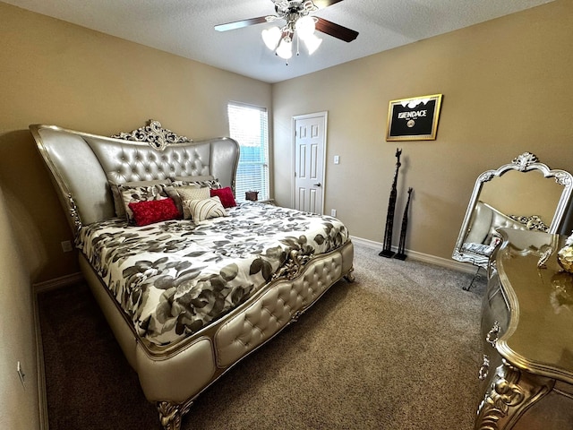 carpeted bedroom with a textured ceiling and ceiling fan