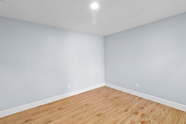 empty room featuring wood-type flooring