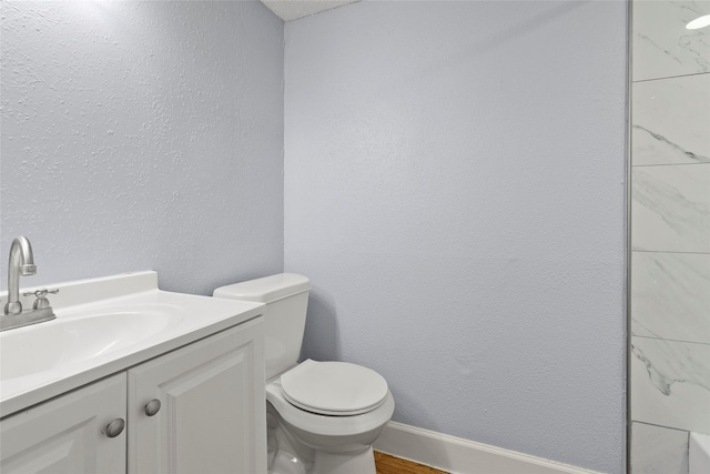 bathroom featuring hardwood / wood-style flooring, vanity, and toilet