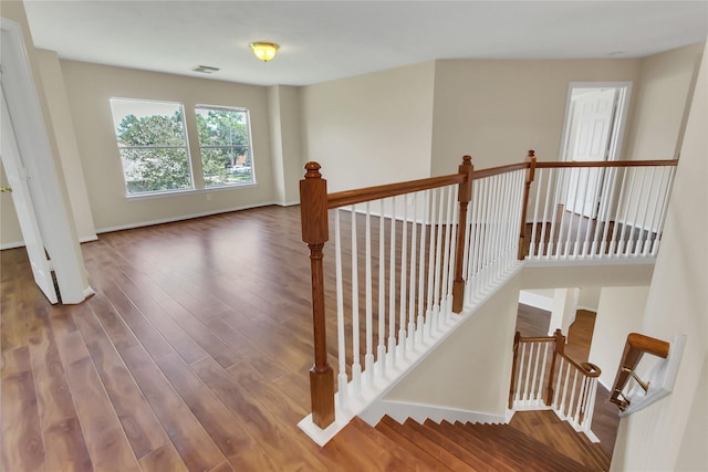 staircase featuring hardwood / wood-style floors