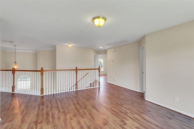 spare room featuring hardwood / wood-style flooring