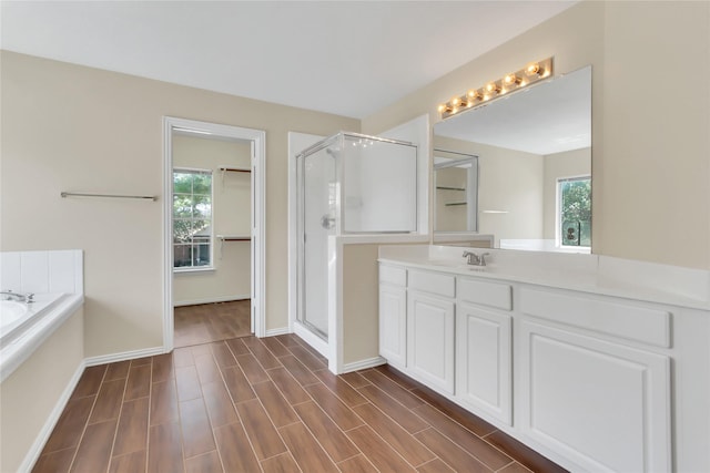 bathroom with plus walk in shower and vanity