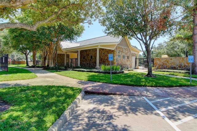 ranch-style home featuring a front lawn