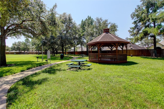 view of home's community with a gazebo and a yard