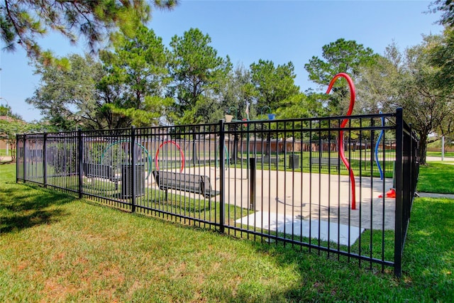 view of gate featuring a yard