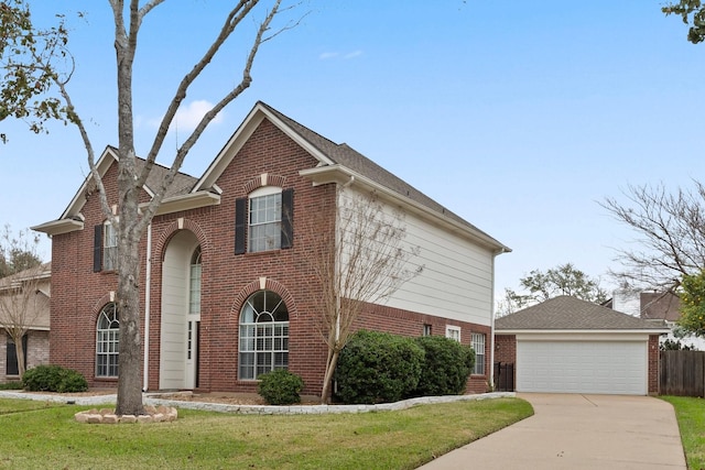 view of front property featuring a front lawn and a garage