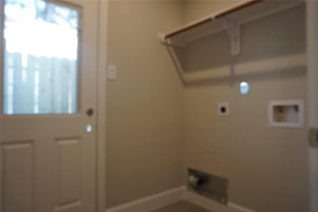 clothes washing area featuring electric dryer hookup, tile patterned floors, and washer hookup