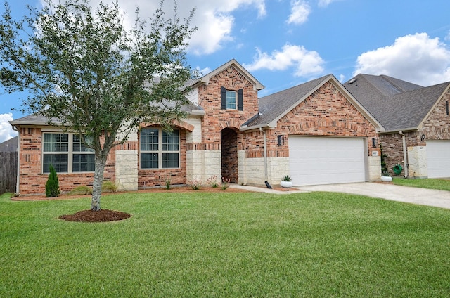 view of front of property with a garage and a front yard